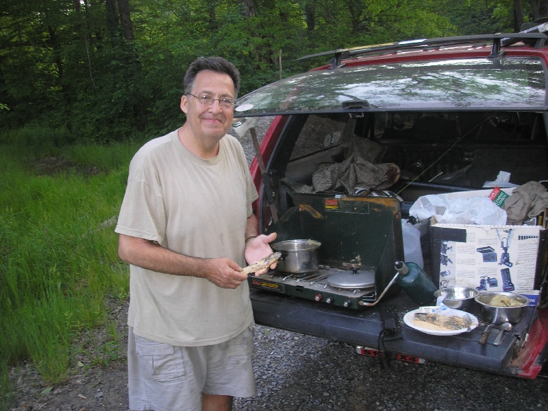 Dad cooking fresh wild trout